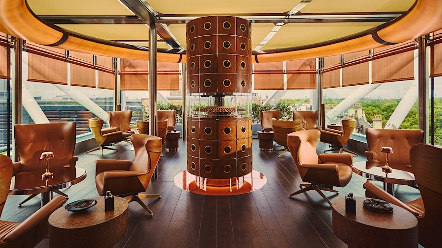 Sunlit cigar lounge with leather seating and panoramic windows
