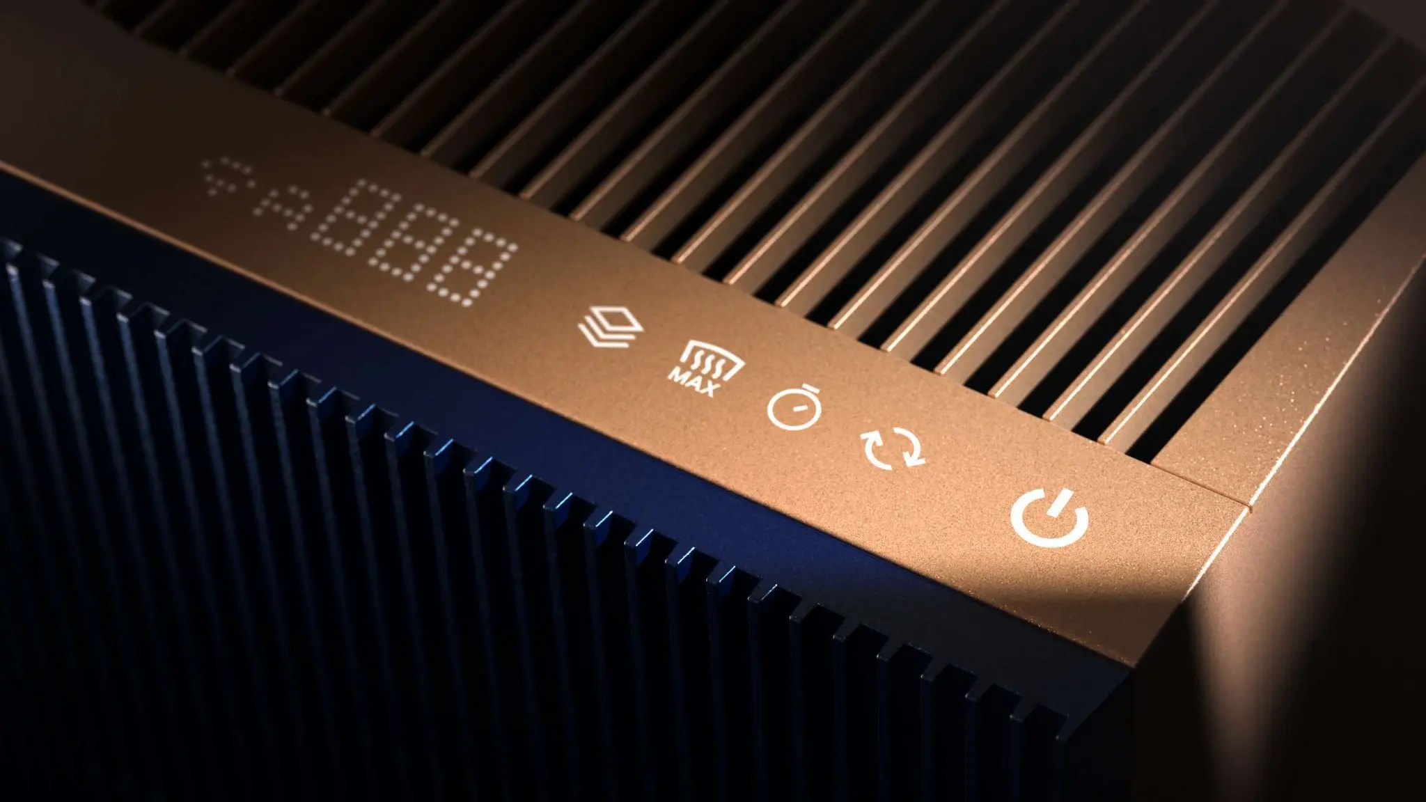Close-up of the control panel and top grille in a rose-gold-toned finish