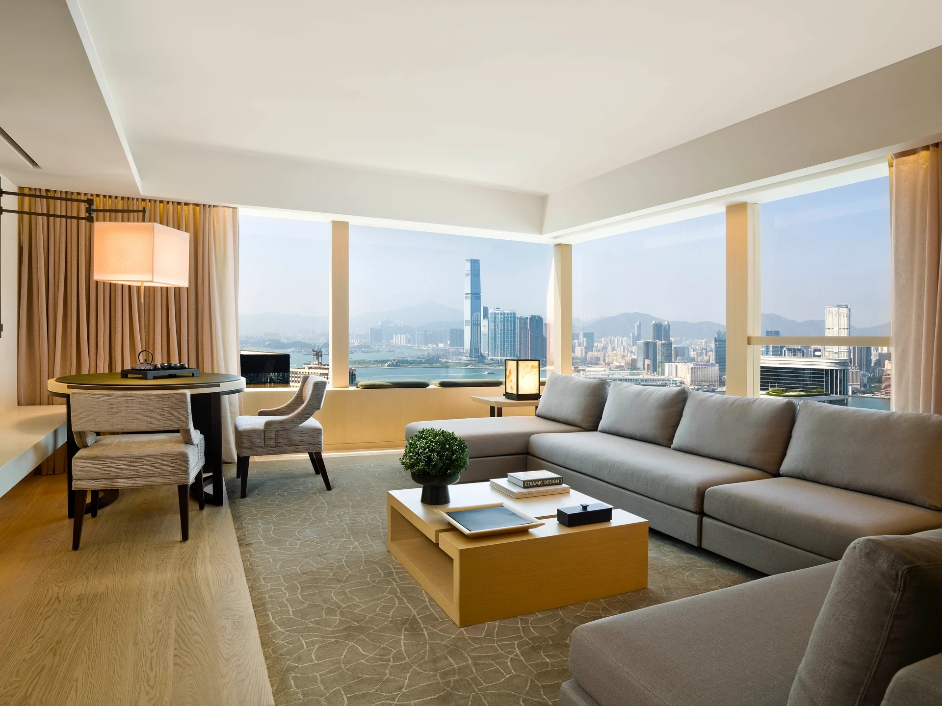 A neutral-toned living space at Upper House Hong Kong overlooking Victoria Harbour