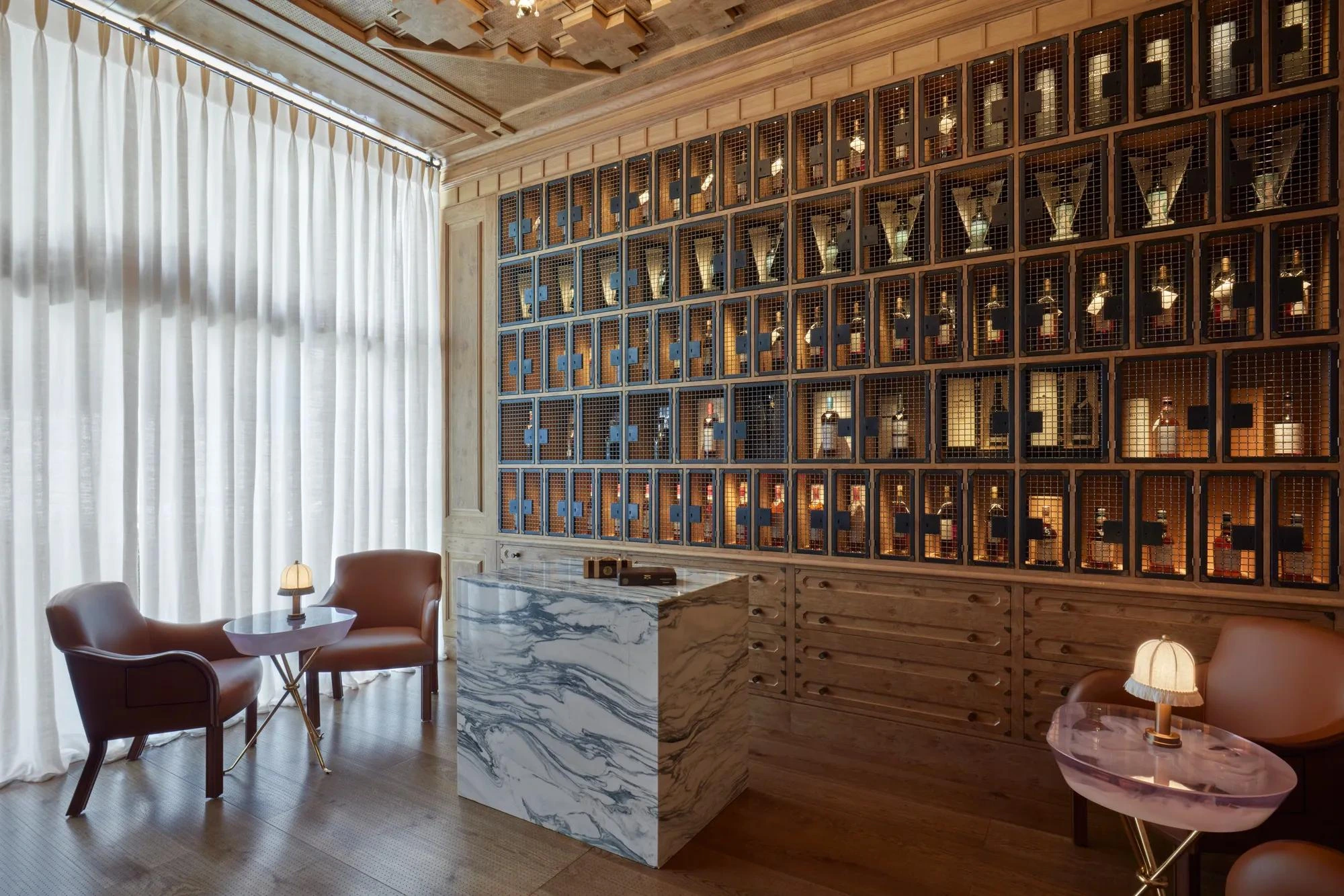 Warm wood, leather seating and a humidor at The Connaught Cigar Merchants in London